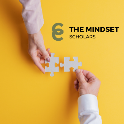 THE MINDSET SCHOLAR logo and two hands holding puzzle pieces on yellow background.